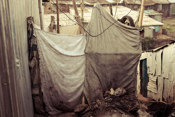 A communal shower, in the heart of the slum